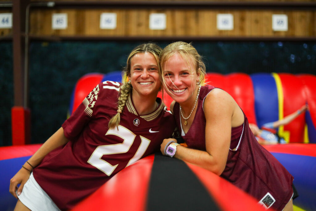 Two Florida State University students smiling while at summer camp