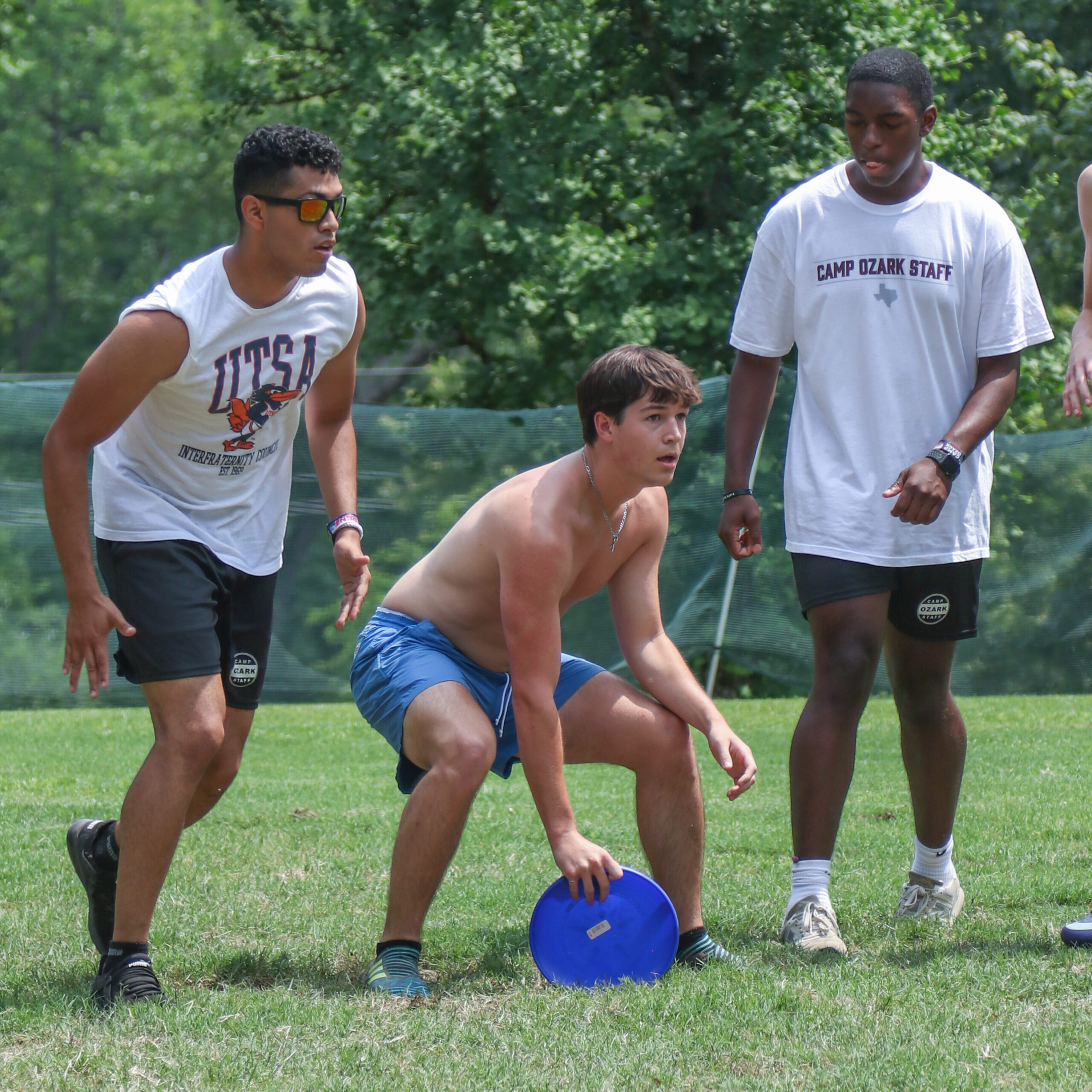 University of Texas students playing frisbee at summer camp