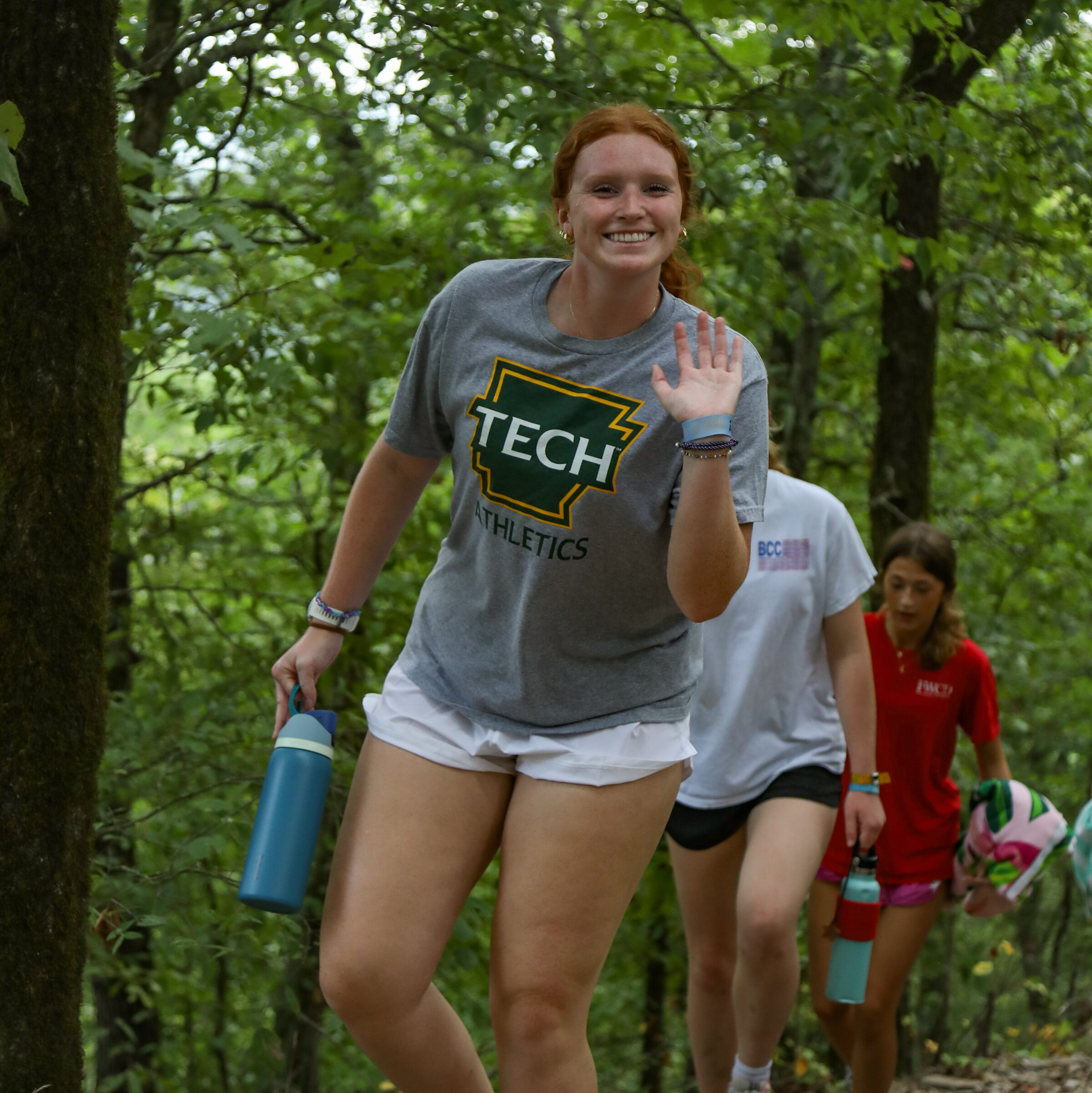 Arkansas Tech student waving while at summer camp